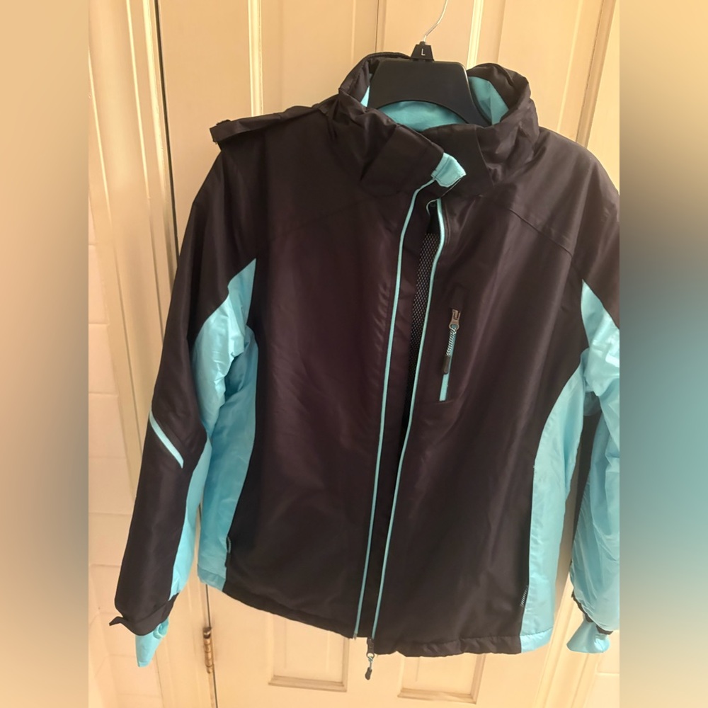 Crivit Technogy ski and cold weather jacket. Plenty of pockets. Black and aqua.
